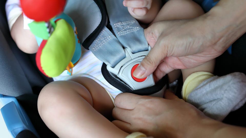 Baby in a car seat.