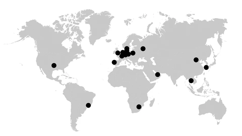 Map in grayscale with black dots marking countries that hosted the conference. 