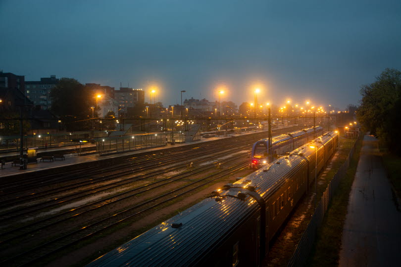 Trains on a misty station.