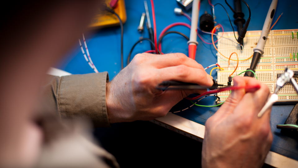 Man working with electronics