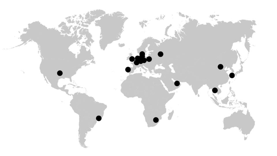 Map in grayscale with black dots marking countries that hosted the conference. 