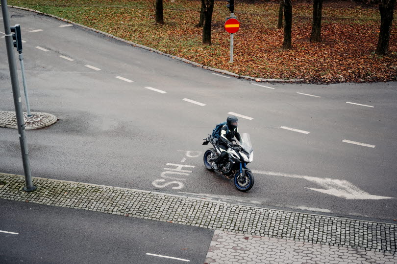 Road with motor cyclist