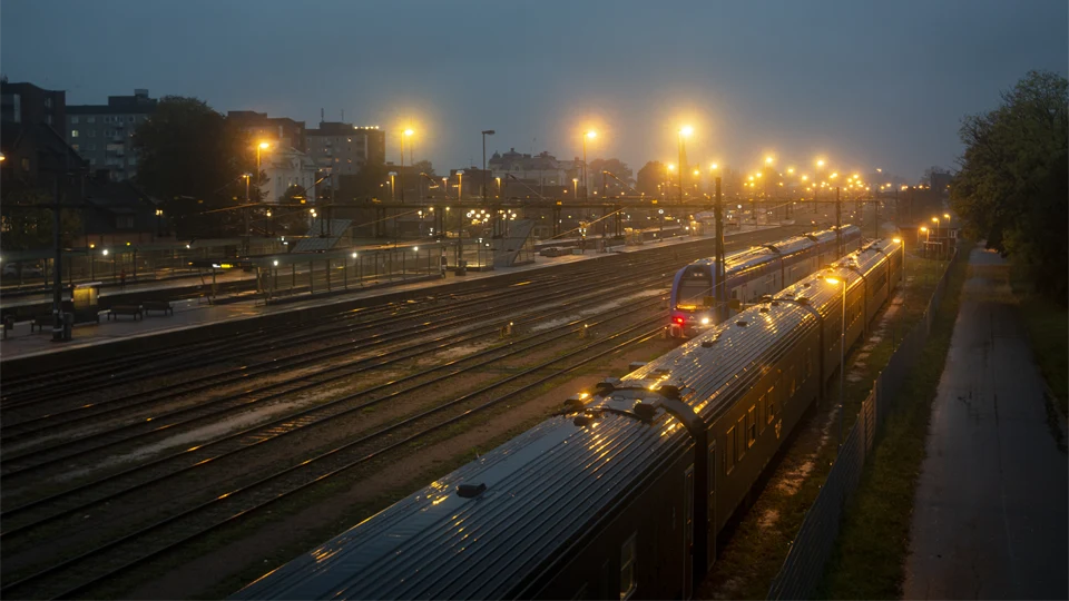 Trains on a misty station.