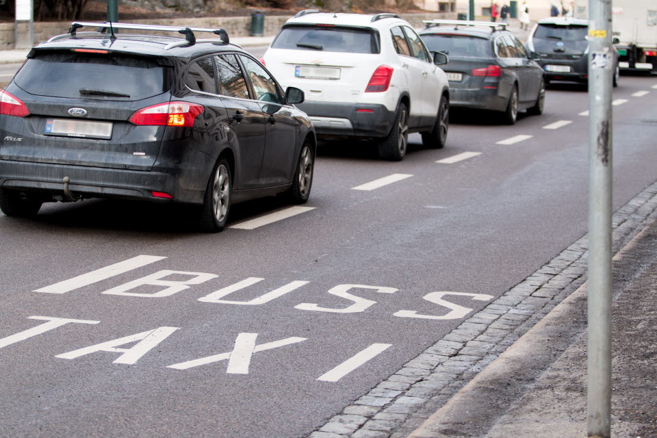 Road with lane for taxis and buses.