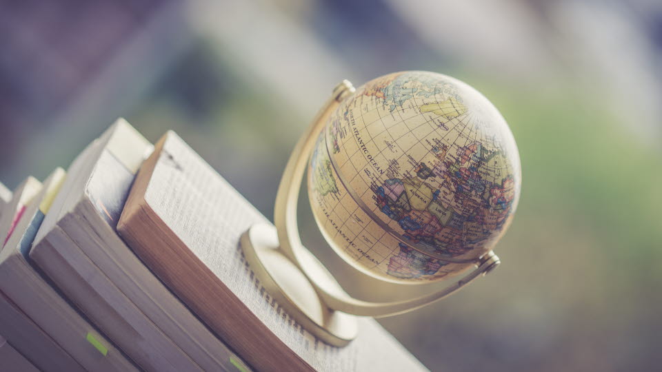  Small globe on a stack of books.